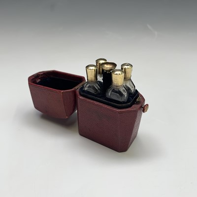 Lot 2506 - A French gold mounted perfume set with four...