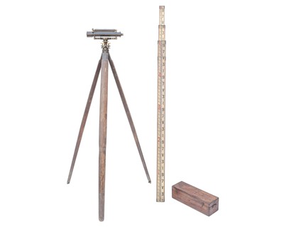 Lot 737 - A Stanley surveyor's theodolite, tripod and staff.