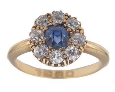 Lot An attractive Victorian 18k diamond and cushion-cut blue sapphire set cluster ring.