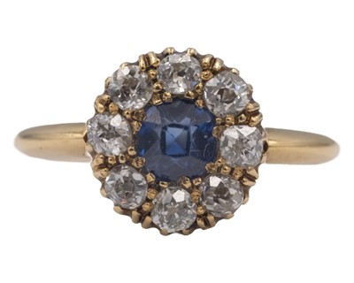 Lot An attractive Victorian 18k diamond and cushion-cut blue sapphire set cluster ring.