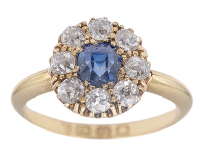 Lot An attractive Victorian 18k diamond and cushion-cut blue sapphire set cluster ring.