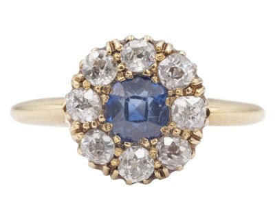 Lot An attractive Victorian 18k diamond and cushion-cut blue sapphire set cluster ring.