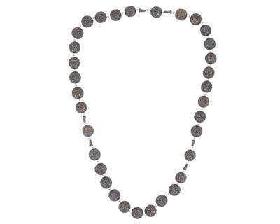 Lot 32 - A set of carved and stained wood rosary beads.