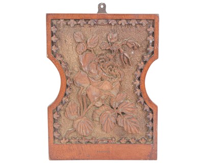 Lot 10 - A shaped mahogany plaque.