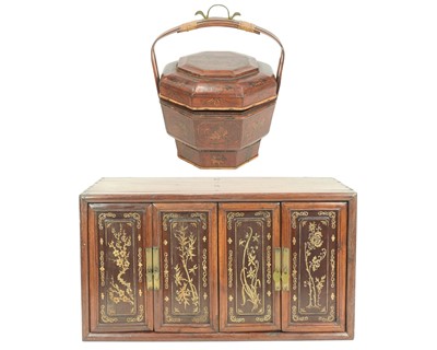 Lot 554 - A Chinese hardwood table cabinet.