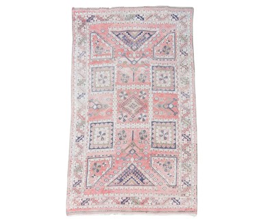 Lot 566 - A Turkish wool carpet.