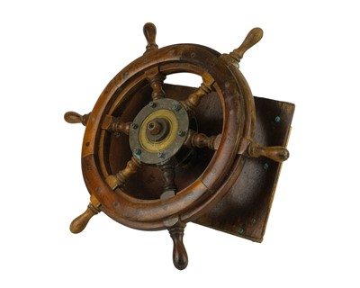 Lot 413 - A small brass and teak boat wheel.