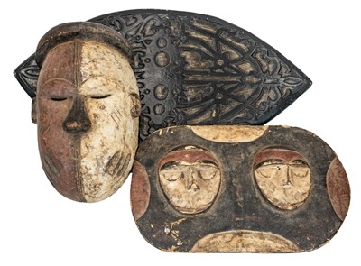 Lot 51 - An African carved wood tribal shield.
