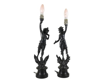 Lot 781 - A pair of black painted spelter figural table lamps.