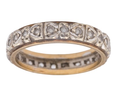 Lot 200 - A 9k yellow and white gold, white synthetic spinel set, full eternity ring.