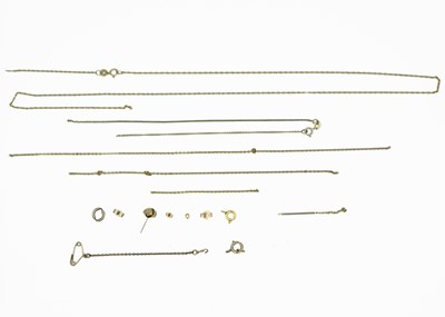 Lot 206 - A selection of scrap gold and yellow metal, mostly chains and findings.