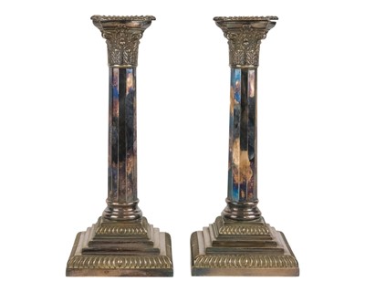 Lot 465 - A pair of silver plated Corinthian column design candlesticks.