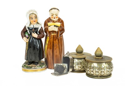 Lot 668 - A Royal Worcester candle snuffer in the form of a monk, and a figurine of a nun.