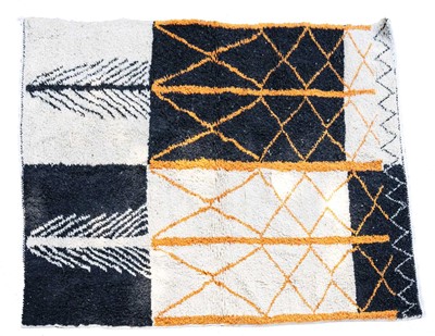 Lot 210 - A Moroccan Berber wool abstract design rug.