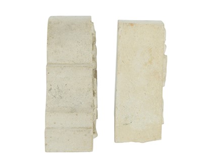 Lot 24 - A pair of carved stone bookends.