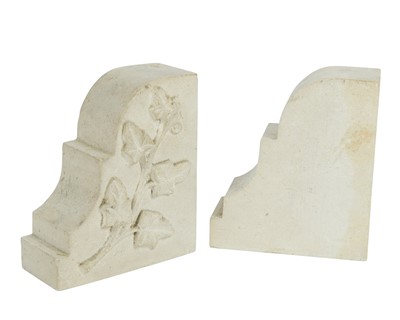 Lot 24 - A pair of carved stone bookends.