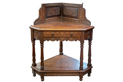 Lot 914 - A Victorian carved oak corner table.