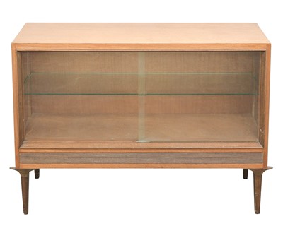 Lot 299 - A mid 20th century teak low display cabinet.