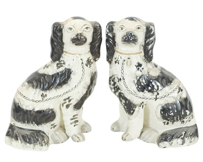 Lot 734 - A pair of Victorian Staffordshire pottery dogs.