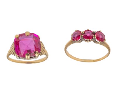 Lot 63 - Two synthetic ruby-set gold rings.