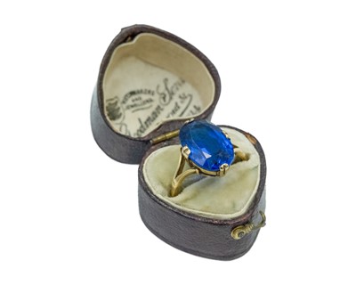 Lot 48 - A synthetic blue spinel solitaire ring, set in high-purity gold.