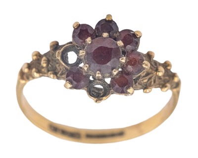 Lot 209 - A 9k hallmarked gold garnet set cluster ring.