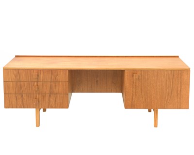 Lot 99 - A teak low sideboard/desk.