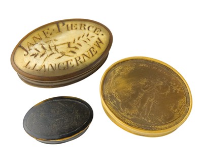 Lot 805 - Three 19th century oval horn snuff boxes.