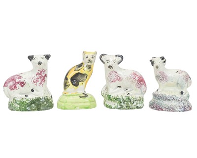 Lot 809 - A pair of Staffordshire pottery figures of sheep.
