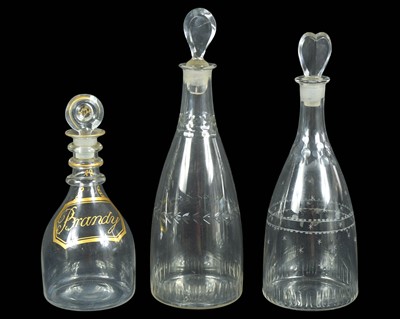 Lot 685 - Three George III glass decanters and stoppers.