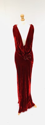 Lot 2815 - Two long, bias cut evening dresses. One in red...