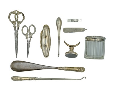 Lot 59 - A selection of silver dressing table accessories.