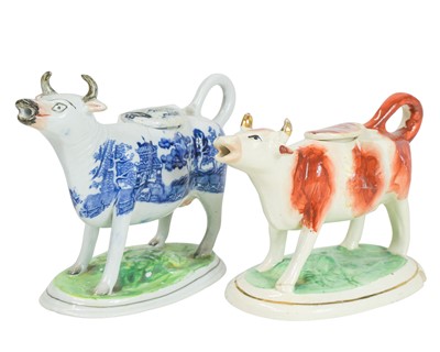Lot 820 - Two 19th century Staffordshire cow creamers.