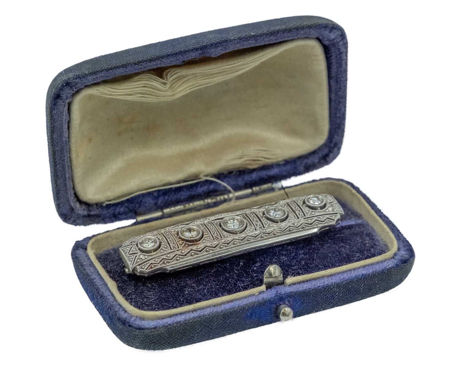 Lot 13 - An Art Deco platinum diamond set bar brooch.