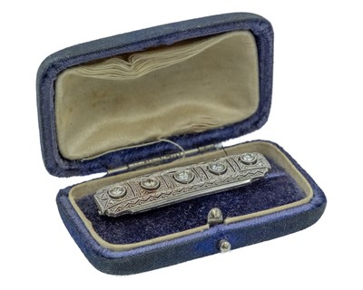 Lot 13 - An Art Deco platinum diamond set bar brooch.