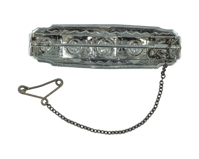 Lot 13 - An Art Deco platinum diamond set bar brooch.