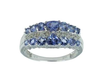 Lot 51 - A modern tanzanite and diamond dress ring, set in white gold.