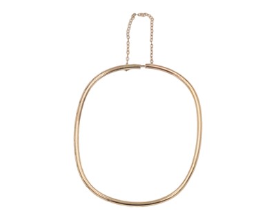 Lot 102 - A 9k yellow gold bangle.