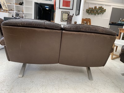 Lot 254 - A brown leather De Sede DS-31 sofa and two swivel chairs.