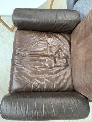Lot 254 - A brown leather De Sede DS-31 sofa and two swivel chairs.
