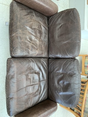Lot 254 - A brown leather De Sede DS-31 sofa and two swivel chairs.