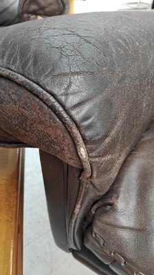 Lot 254 - A brown leather De Sede DS-31 sofa and two swivel chairs.