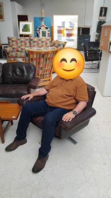 Lot 254 - A brown leather De Sede DS-31 sofa and two swivel chairs.