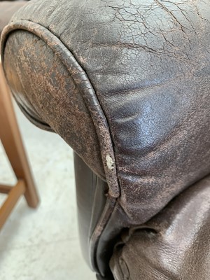 Lot 254 - A brown leather De Sede DS-31 sofa and two swivel chairs.