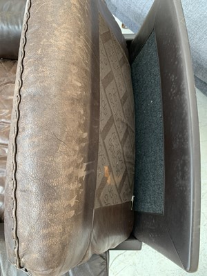 Lot 254 - A brown leather De Sede DS-31 sofa and two swivel chairs.