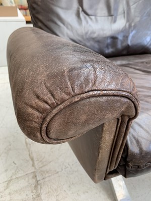 Lot 254 - A brown leather De Sede DS-31 sofa and two swivel chairs.