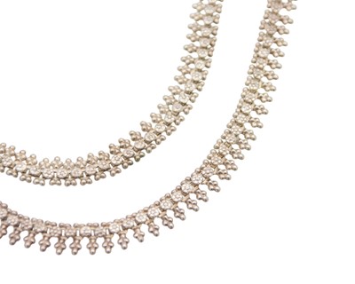 Lot 185 - A pair of Indian white metal ghungru anklets.