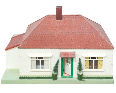 Lot 192 - An early 20th century dolls house modelled as a 1930s bungalow, with lift off roof.