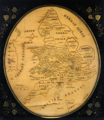 Lot 638 - An oval silk and needlework map sampler.