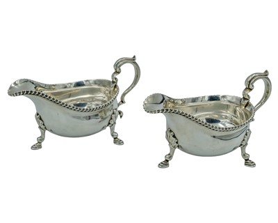 Lot 104 - A pair of silver sauce boats by Thomas Bradbury & Sons Ltd.